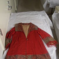 Front View of Red Fringed Coat with Paisley Trim