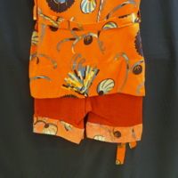 Detail View of Red Bathing Suit with Orange Print Tunic and Belt  with Tunic and Belt
