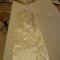 Detail View of Satin Wedding Dress with Sequined Jacket