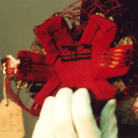 View of Label in Red Velvet Headpiece with Veil