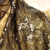 Detail View of Black and Gold Beaded Dress