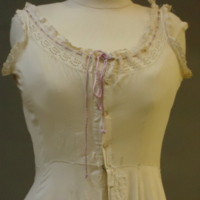 Detail View of Chemise with Purple Ribbon