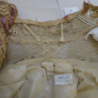 Condition View of Ivory Lace Bodice with Lavender Bows