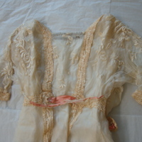 Detail View of Peach Day Dress with Floral Motif