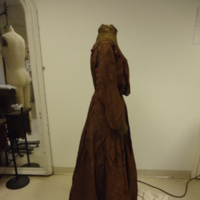Side View of Brown Silk "Eugenie" Dress with Lace Appliques