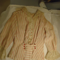 Detail View of White Ensemble with Red Stripes