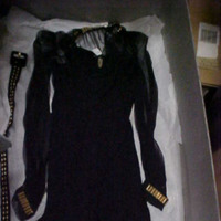 Front View of Black Dress with Gold Metal Trim