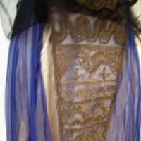 Detail View of Black Blue and Gold Multilayered Dress